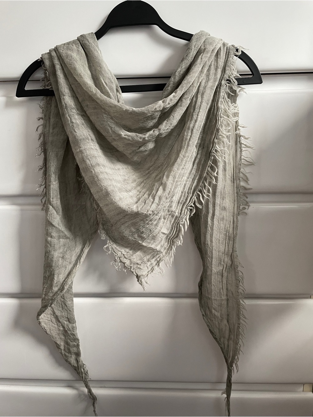 Eileen Fisher linen triangle scarf with frayed edging, color sand.